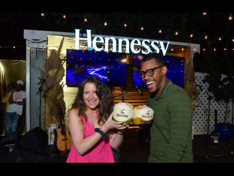 A Hennessy-infused coconut toast. Hennessy Brand Protection Manager, Flavie Jost (left) and Partner at Livingston Alexander and Levy Attorneys-at-law, Mikhail Jackson are having a blast.