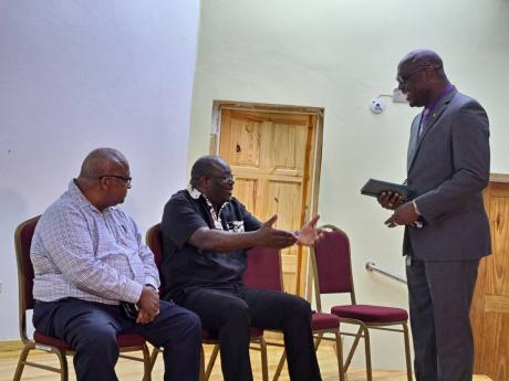 Darian Henry (right), principal of the Montego Bay Community College [MBCC] in St James, chats with Cordel Green (centre), executive director of the Broadcasting Commission of Jamaica, and Lloyd B. Smith, vice-president of the Press Association of Jamaica 