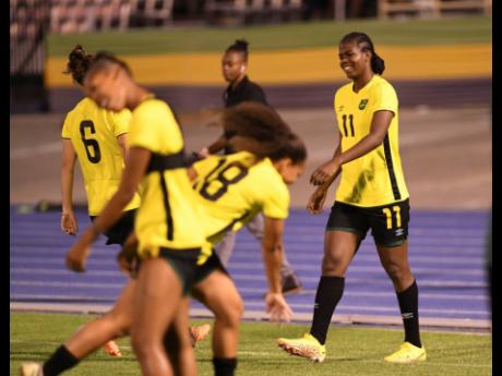 
Khadija Shaw (right) enjoys a light moment with teammates during a Reggae Girlz training session at the National Stadium in December of 2022.