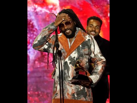 Kabaka Pyramid accepts the award for Best Reggae Album for 'The Kalling' at the 65th annual Grammy Awards in Los Angeles last Sunday.  'The Kalling' was one of five albums nominated in the category. 