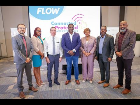 Representatives from partner organisations join Flow’s Vice-president and General Manager, Stephen Price (centre), for a photo op during the launch of Flow’s Safer Internet campaign #ConnectedandProtected, at the AC Hotel on Tuesday, January 31. From l