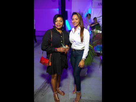 Annamarie Curtis (left), client relationship manager at eGov Jamaica, and Jeneal Bowla (right), sales manager at BMW Jamaica, strike a pose for our lens.