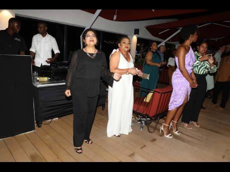 From left:  Digicel Foundation chair Jean Lowrie-Chin and board director Heather Moyston light up the dance floor.