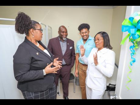 From left: Sagicor Life Jamaica’s (SLJ) Jacqueline Brown-Barnes, vice-president, Employee Benefits Division – Group Insurance Services; Philbert Perry, assistant vice-president – Individual Life; Dr Mario Guthrie, sessional doctor, and Andrea Taylor,