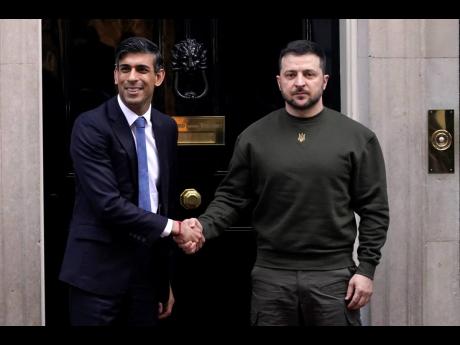 Britain’s Prime Minister Rishi Sunak (left) welcomes Ukraine’s President Volodymyr Zelenskyy at Downing Street in London on Wednesday. It is the first visit to the UK by the Ukraine president since the war began nearly a year ago. 