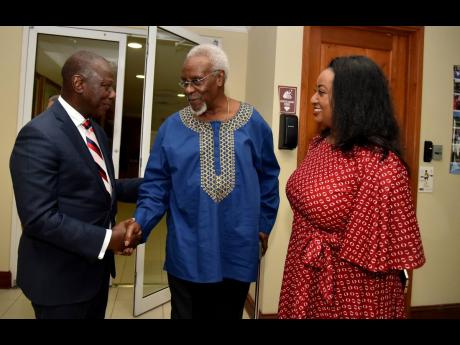 From Left: Sierra Leone High Commissioner to Jamaica Sidique Wai is greeted by P.J. Patterson, former prime Minister of Jamaica and statesman-in-residence at the P.J. Patterson Institute for Africa-Caribbean Advocacy, as Yodit Hylton, honorary consul for E