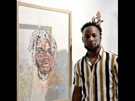 Richard Gayle stands alongside his work, Young Legend, painted in acrylic on aluminum mesh.
