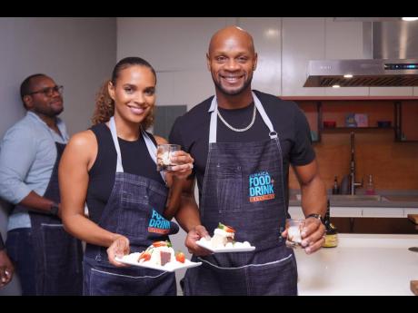 Olympian Asafa Powell and his wife, Alyshia, pose with their dessert creations.