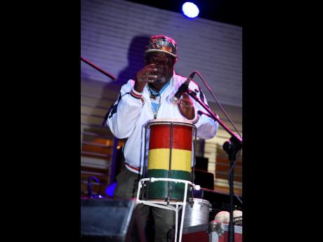 Percussionist Bongo Herman show off his skill on stage. 