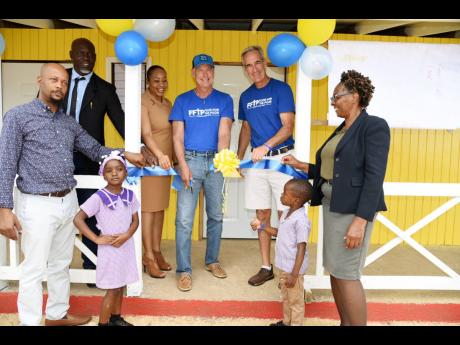 From left: Jason Whittingham, principal of Content Primary and Infant School; Godfrey Walters, representing Daniel Lawrence, member of parliament for Westmoreland Eastern; Jacqueline Brown, acting senior education officer in Region Four of the Ministry of 