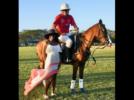 Etosha Thurman (left), poses with polo player Dan Keating at the annual Hanover Charities and Chukka Foundation Polo Event held on Sunday.