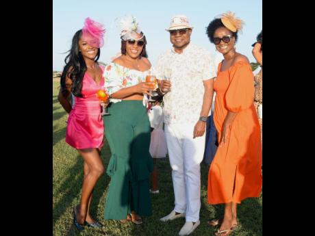 Minister of Tourism Edmund Bartlett (second right), with Tahjaera Thompson, Sherica Thelwell and Felicia Clarke.