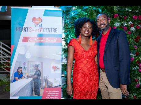 Everod Wilson, director of sales, Rainforest Seafood, poses with Heart Smart Centre’s Dr Claudine Lewis. 