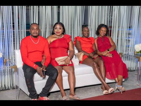 From left: Philip Parr supports partner, Dionne Nesbeth as she sits with fellow Heart Smart Centre Wear Red ambassadors Venetta Smith-Bowen and Sandra Thomas.