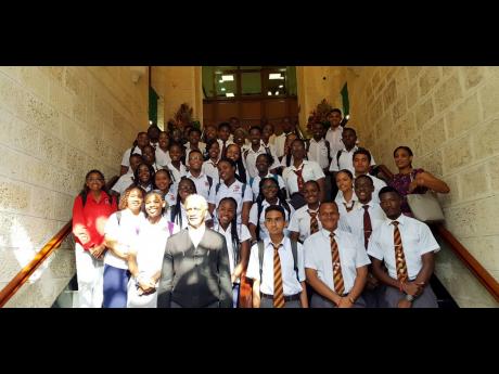  Principal of Campion College Grace Baston (left) poses with the speaker of the House of Parliament in Barbados, Honourable Arthur Holder (foreground), and students of Campion and Harrison colleges.