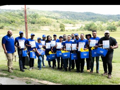 Participants in the Nutramix and Select Sires artificial insemination (AI) training exercise show off their certificates after completing their course in AI in cattle. 