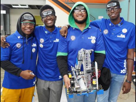 The Jamaica College Blue Bots team poses with their winning robot.