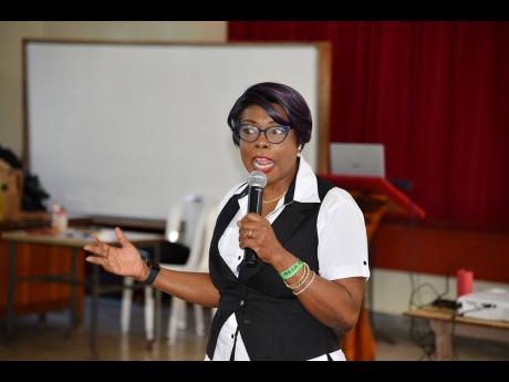 Retired Deputy Commissioner of Police Novelette Grant, founder of Enough is Enough, conducting a session at the recent anti-domestic violence workshop in Montego Bay, St James.