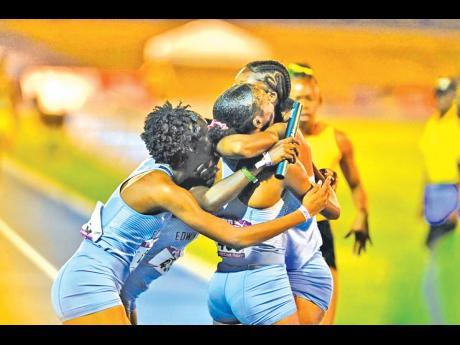 Edwin Allen High School’s girls celebrate their win in the  4x400 metres Open at the Gibson McCook Relays last Saturday.