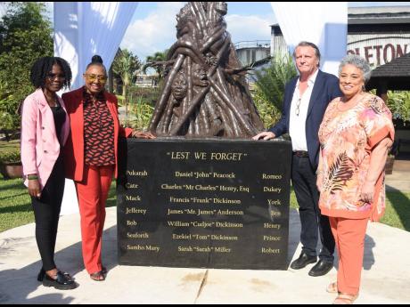 From left: Sculptor Trishaunna Henry; Culture Minister Olivia Grange; Jean-Phillippe Beyer, managing director, J. Wray & Nephew Limited; and master Blender Joy Spence at the unveiling of the Lest We Forget monument at the Appleton Estate in St Elizabeth on
