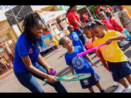 Marjaalaine Francis, social worker at Grace and Staff Foundation, engages with students at the St Joseph Infant School in downtown Kingston during a ‘Playdate’ initiative by the Grace and Staff Foundation on February 21. A team of staff members across 