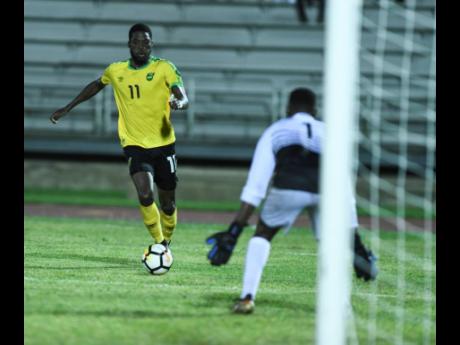Reggae Boy Shamar Nicholson dribbles to goal during a Concacaf Nations League game at the Montego Bay Sports Complex.