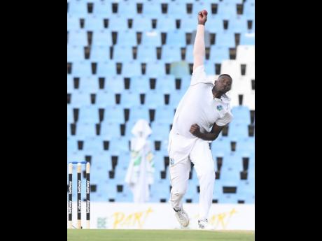 West Indies all-rounder Jason Holder bowls on the second evening of a Test match against South Africa at SuperSport Park in South Africa yesterday.