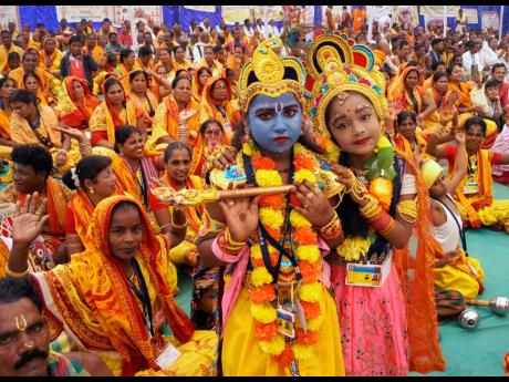 
Children dressed as Radha (right) and Krishna.