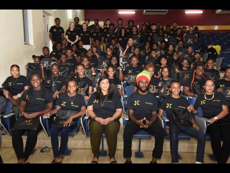 Chronixx (seated third right) with the graduating class and lecturers of the Coding and Algorithms Camp 2022, which he funded.  Chronixx says it will be an annual camp, free of cost to Jamaican students who are equipped to do coding.  The camp was held at 