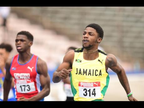 Jamaica’s Bouwahjgie Nkrumie competing in the under 20 100 metres heats at last year’s Carifta Games at the National Stadium.