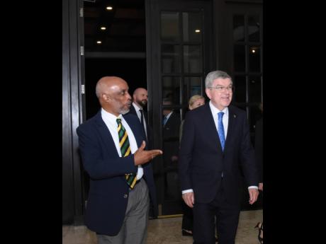 Christopher Samuda (left), President of the Jamaica Olympics Association greets Thomas Bach, President of the International Olympic Committee, on his arrival at the Jewel Grande hotel on Friday, March 3. 