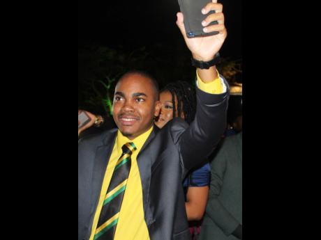 Tahje Wallen enjoying himself at the recent Prime Minister’s National Youth Awards for Excellence, held on the lawns of Jamaica House.