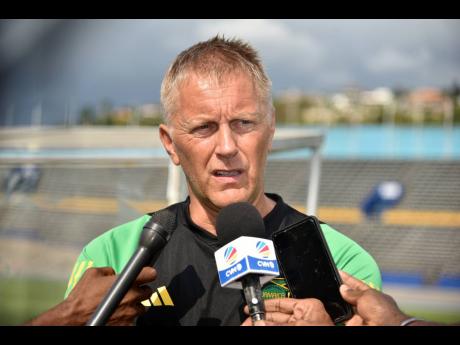 Reggae Boyz head coach, Heimir Hallgrimsson speaks to media ahead of a training session at the National Stadium in preparation for friendlies against Trinidad and Tobago yesterday.