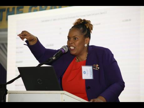La Sonja Harrison, president of the Jamaica Teachers’ Association (JTA), addresses a delegates special conference at The Mico University College in Kingston on Wednesday. The teachers voted 346 to 227 to reject the latest compensation package offer from 