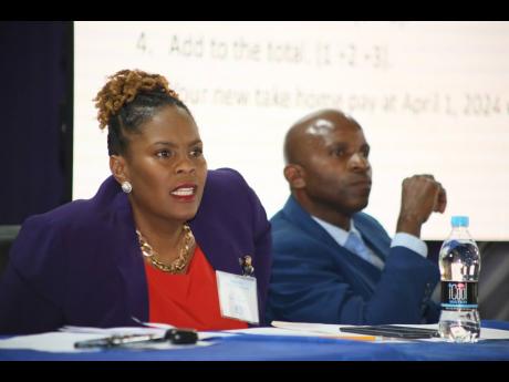 La Sonja Harrison, president of the Jamaica Teachers’ Association (JTA) and Dr Mark Nicely, general secretary of the JTA, listen keenly to delegates during a special conference at The Mico University College in Kingston on Wednesday. The teachers voted 3