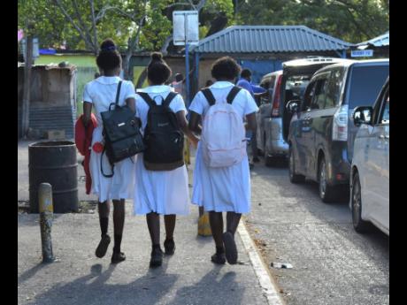 Students seen walking in the Montego Bay Transportation Centre during school hours on the morning of February 9.