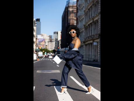 The stylist struts the roadway in a three-piece denim outfit to attend last year’s New York Fashion Week.