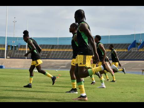 The Reggae Boyz at a training session on Tuesday at the National Stadium.