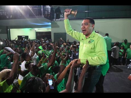 The latest polls show the Andrew Holness-led JLP in a neck and neck race for power.