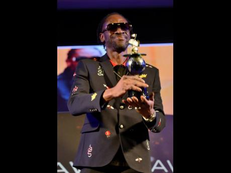 A smiling Bounty Killer received the special IRAWMA Reggae Dancehall Icon Award in 2019. He said that it meant more to him than a Grammy award.