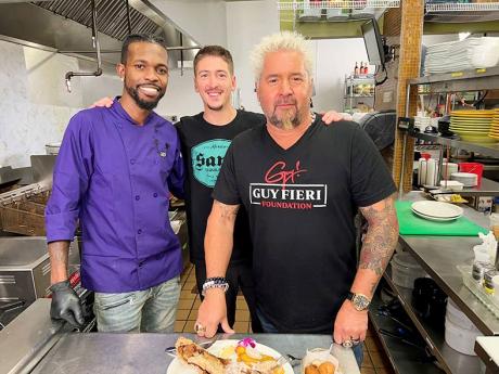 Chef Oniel Smith (left) behind the scenes of filming popular food show, ‘Diners, Drive-Ins, and Dives’, shares lens time with hosts, father-son duo Guy (right) and Hunter Fieri.