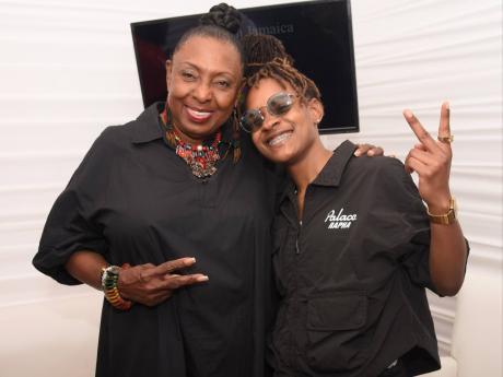 Minister of Culture and Gender, Olivia Babsy Grange shares lens with reggae artiste Koffee at Reggae Sumfest Festival Night 2 at the  Catherine Hall Entertainment Centre on Saturday July 23, 2022.