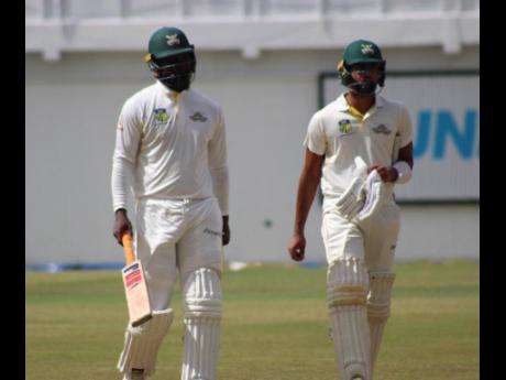 Aldane Thomas (left) and Abhijai Mansingh showed some fight for the Jamaica Scorpions, scoring half-centuries against the Windward Islands Volcanoes on the penultimate date of their West Indies Campionship encounter at the Guyana National Stadium yeterday.