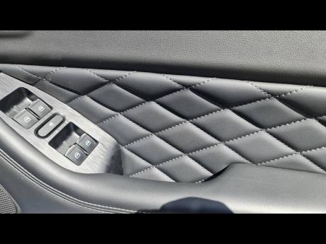 Quilted leather on the door panel. 