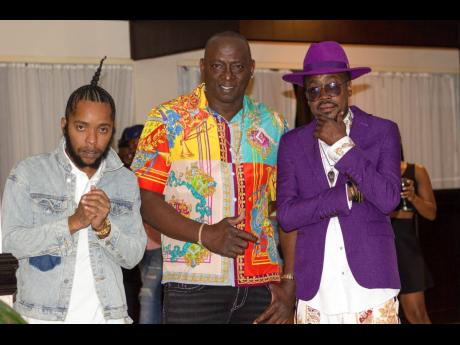 Dancehall artistes, Shane-O and Beenie Man, newly signed to Ciga Records, flank the label’s CEO and founder Shawn Baptiste.