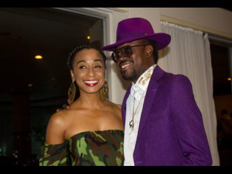 Alaine and Beenie Man are all smiles as their conversation is interrupted by camera lights flashing.
