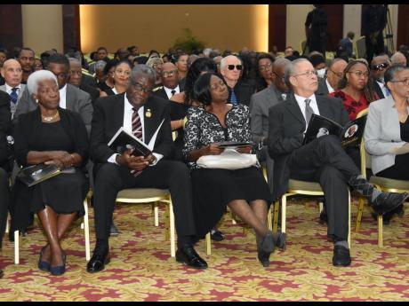 From left: Deverly Pitkin and her husband Conrad Pitkin, custos of St James, and Lorna Golding and her husband Bruce Golding, former prime minister, were among mourners paying tribute to the life of former St James Custos Ewen Corrodus at the Montego Bay C
