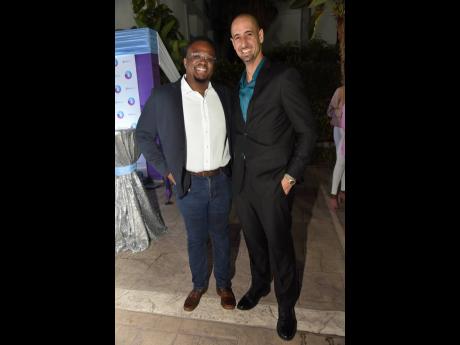 EduFocal CEO Gordon Swaby (left) has a brief business chat with Jeffrey Azan, business consultant and transformational speaker.