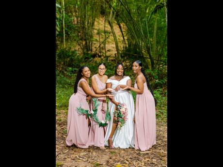 The beautiful bride is joined by her wonderful bridesmaids Daimarei Bonner (left) and Calane Blake (right) along with maid of honour Toni Mogg (second left), who ‘blush’ over her wedding ring.