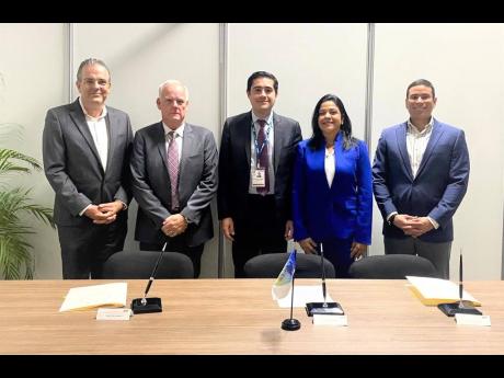The Inter-American Development Bank’s Vice-President for Countries, Richard Martínez (centre), with Caribbean Shipping Association representatives (from left), Group C representative Robert Bosman; president, Lindsay Marc Sampson; general manager, Milai